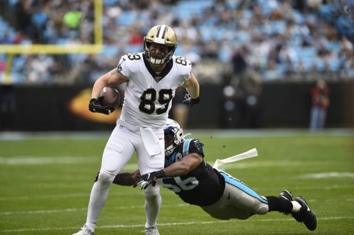 Dec 29, 2019; Charlotte, North Carolina, USA; Saints tight end Josh Hill (89) with the ball as Panthers linebacker Jermaine Carter (56). Mandatory Credit: Bob Donnan-USA TODAY